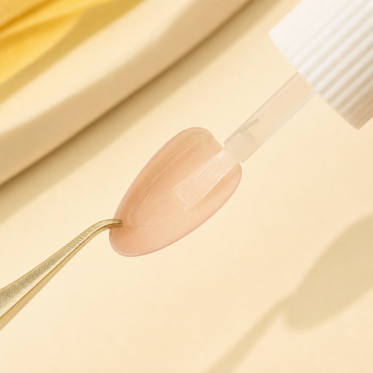 Close-up photo of a thin glue layer applied to one press-on nail